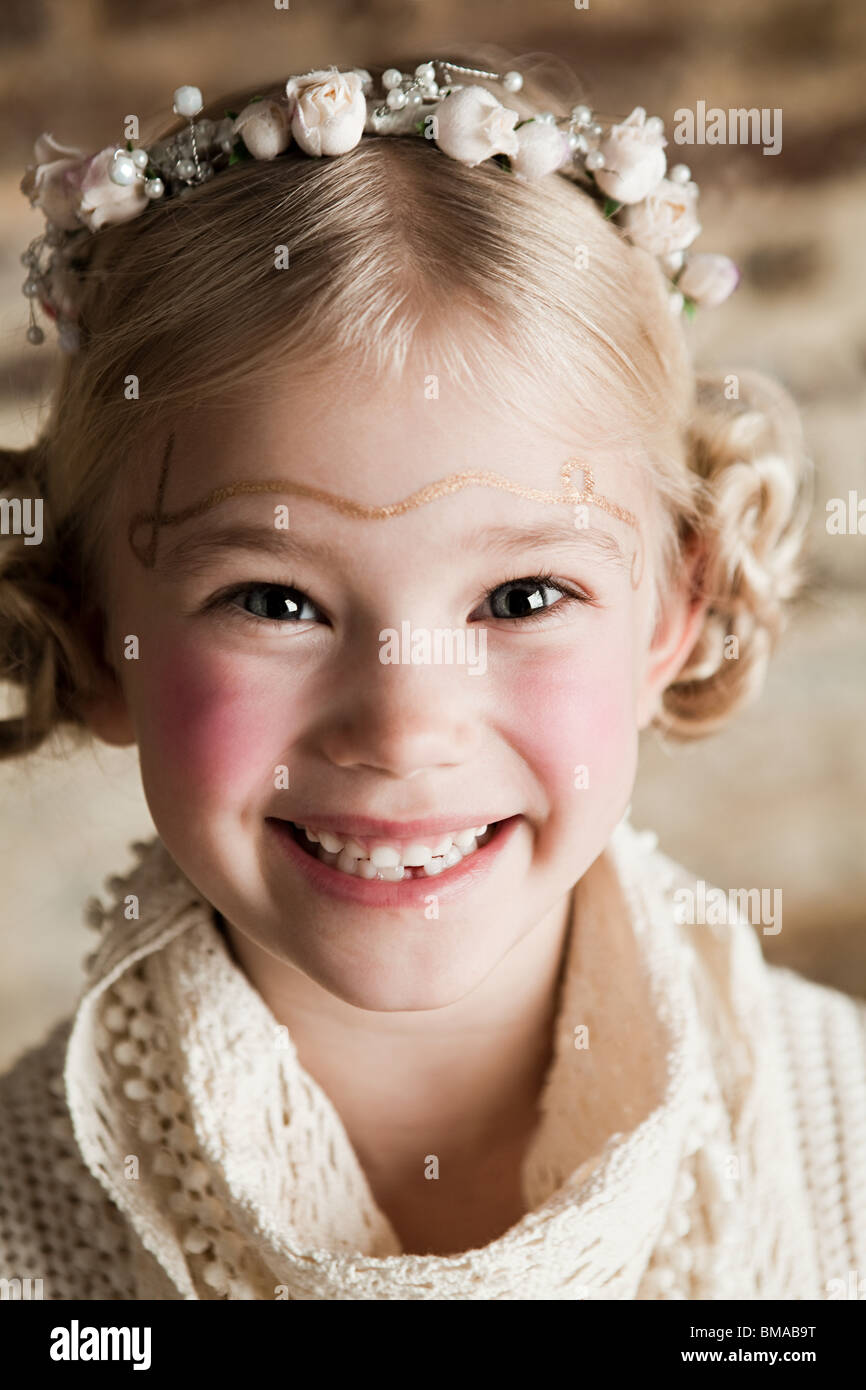 Young girl wearing flowers in hair Stock Photo Alamy