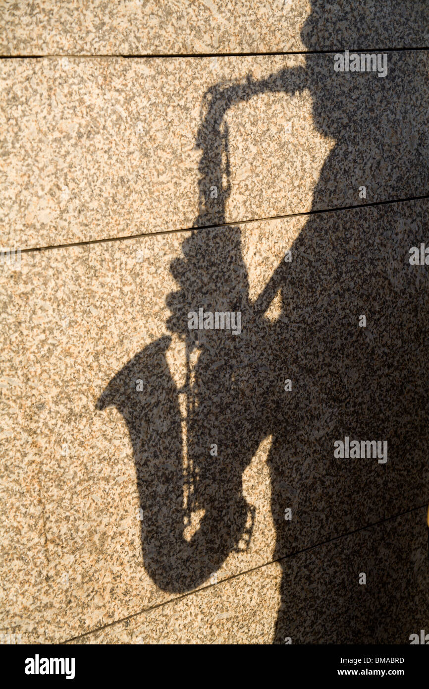 shadow of saxophone player Stock Photo