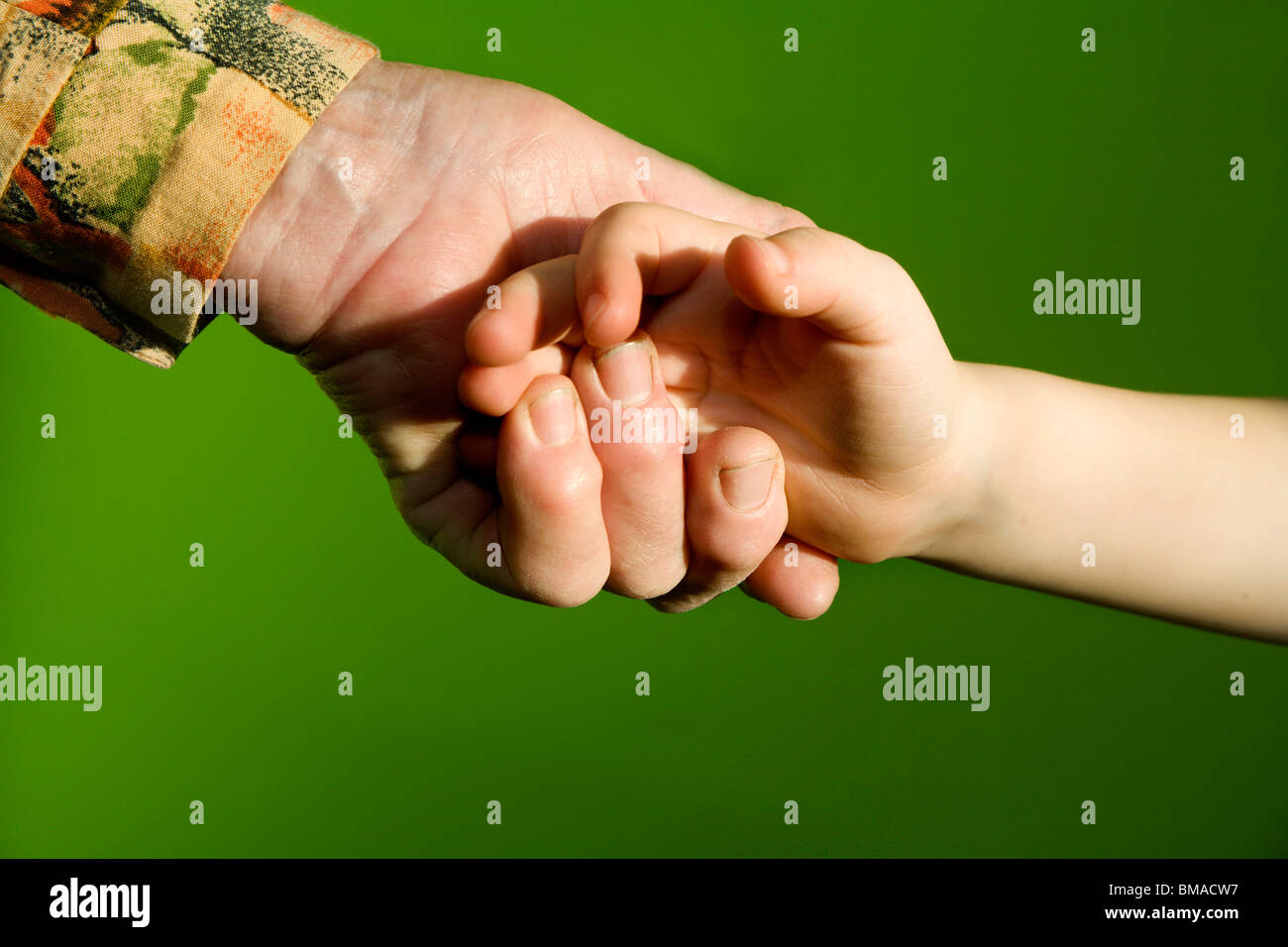 hand of old woman and child Stock Photo