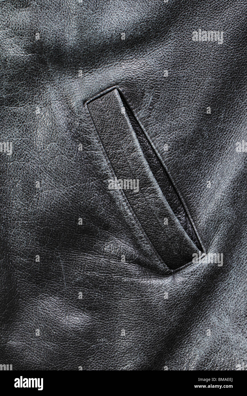 Pocket of an old worn black weather jacket Stock Photo