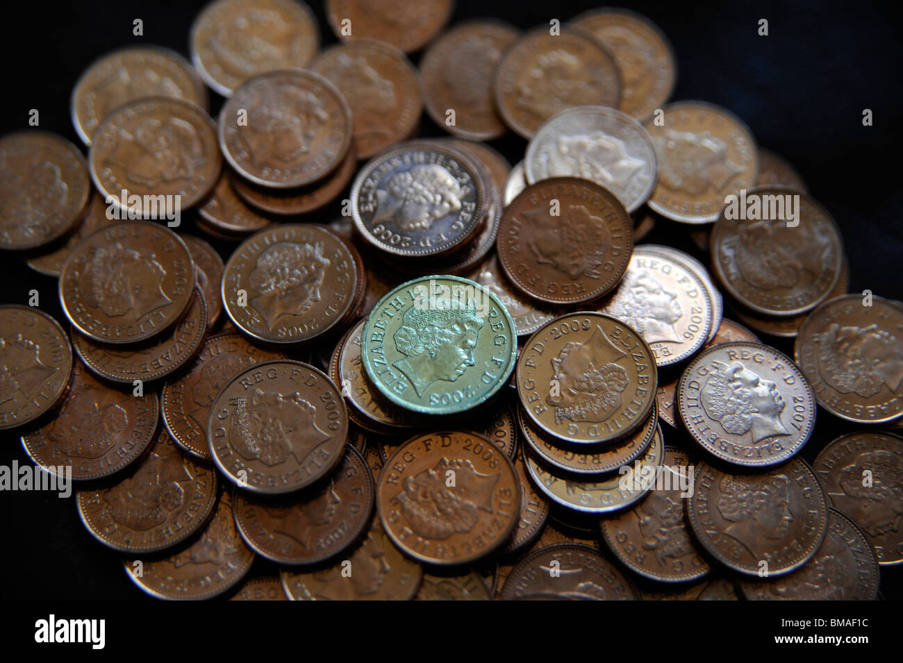Pound coin with pennies. Stock Photo