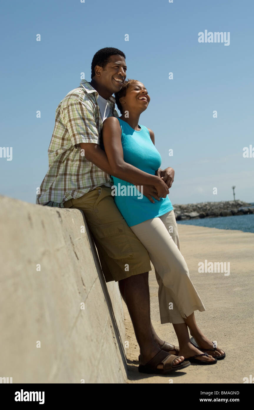 African American couple relaxing outside Stock Photo - Alamy