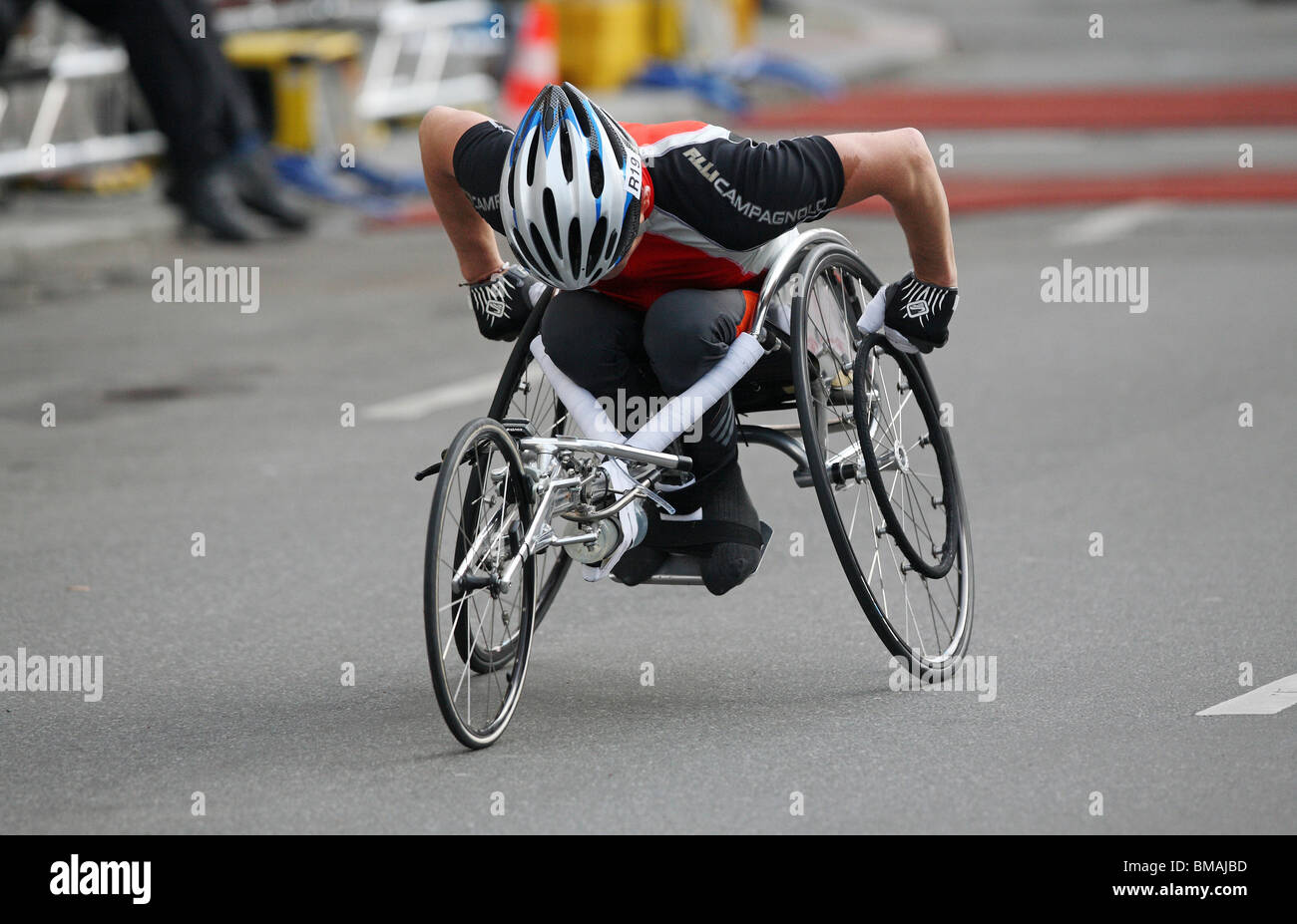 A man on a wheelchair taking part in a marathon, Berlin, Germany Stock Photo