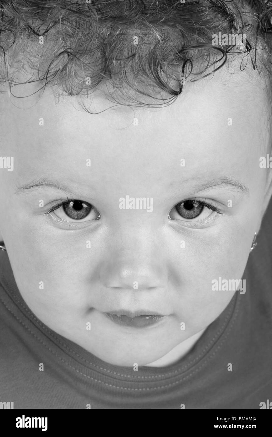Detailed portrait of baby girl looking up at camera Stock Photo - Alamy