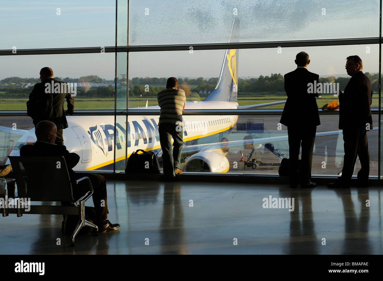 Dublin International Airport.  Terminal interior with passengers waiting to board a 'redeye' early morning flight with Ryanair Stock Photo