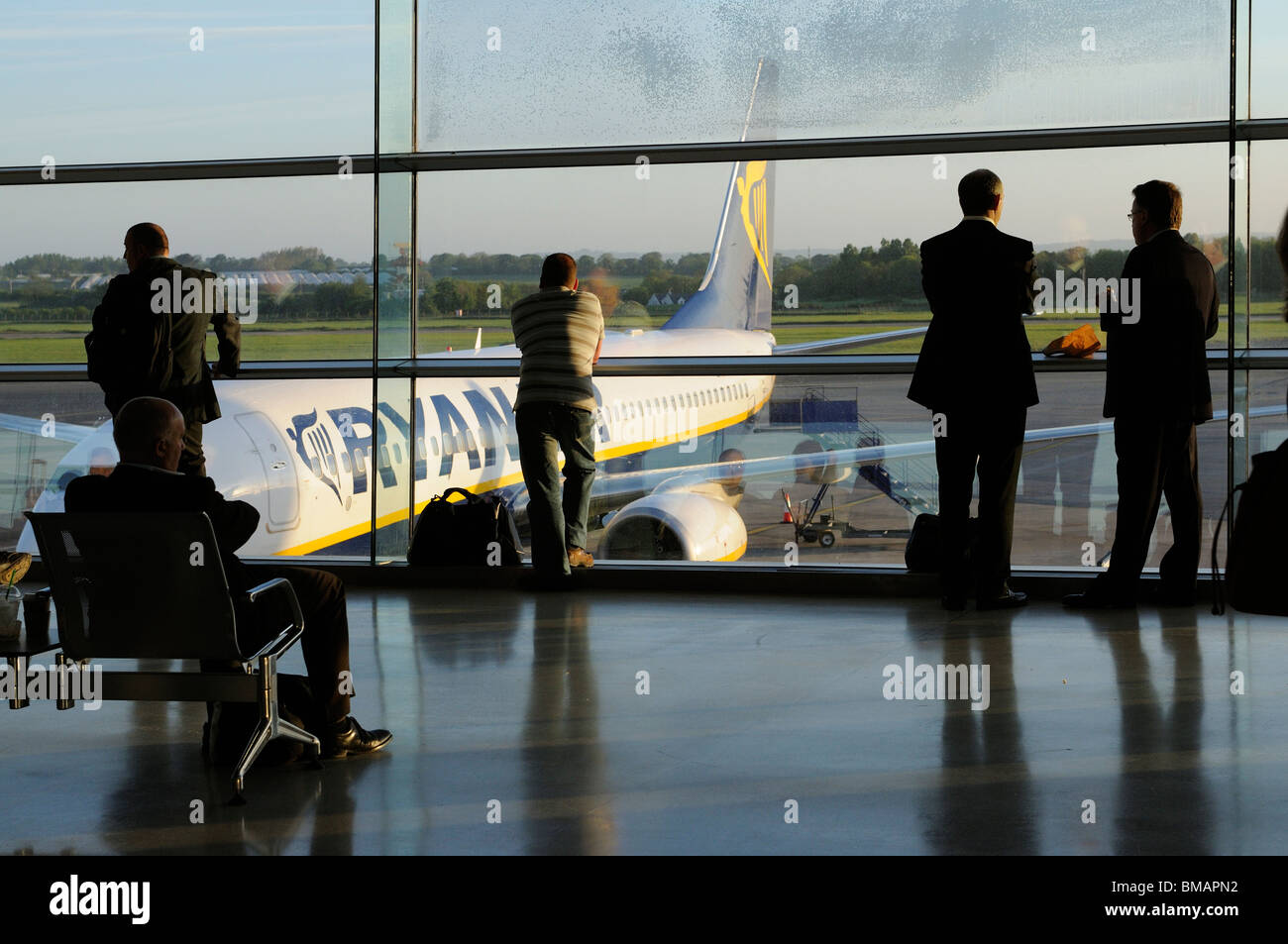 Dublin International Airport terminal interior with passengers waiting to board a 'redeye' early morning flight with Ryanair Stock Photo