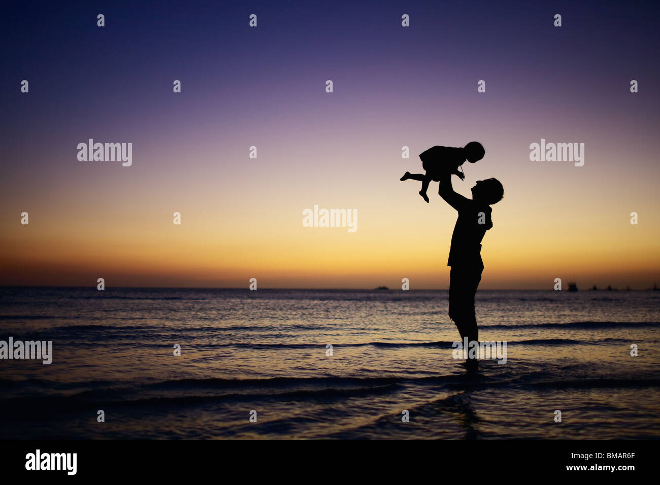Family at sunset Stock Photo - Alamy