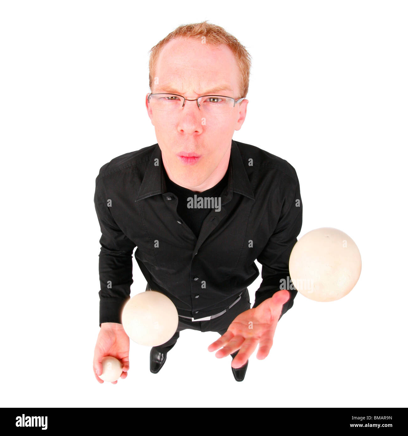 young man juggling with three balls Stock Photo Alamy