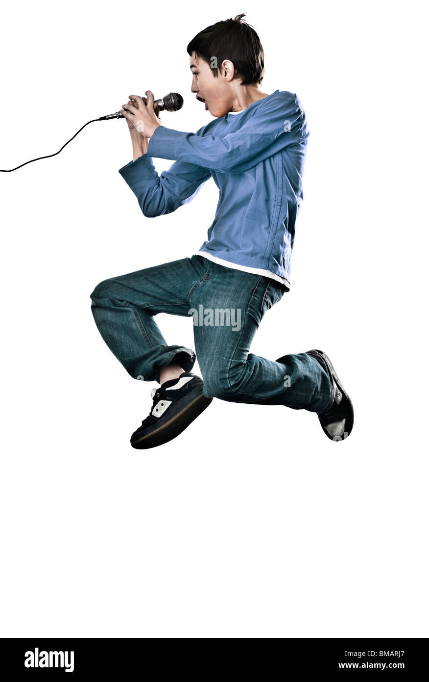 boy jumping with microphone Stock Photo Alamy