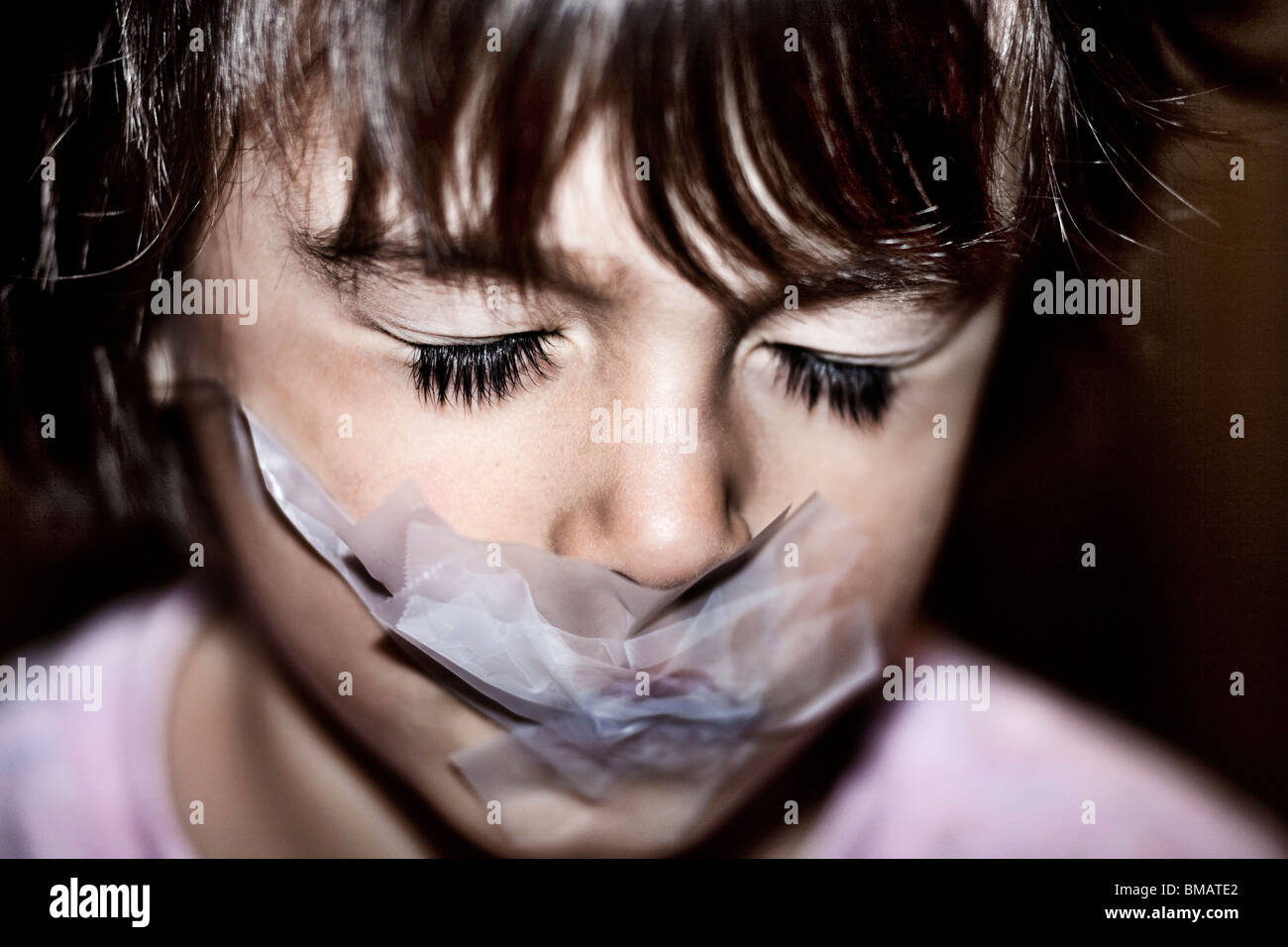 young boy gagged with tape Stock Photo