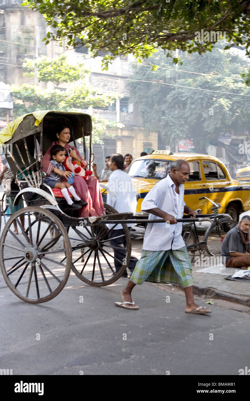 Hand pulling rickshaw puller pulling hires stock photography and images Alamy