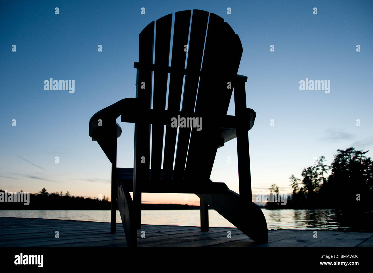 Deck chairs on dock sunset hi-res stock photography and images - Alamy