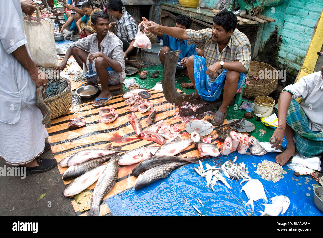 Men selling fish in fish market ; Calcutta now Kolkata ; West Bengal