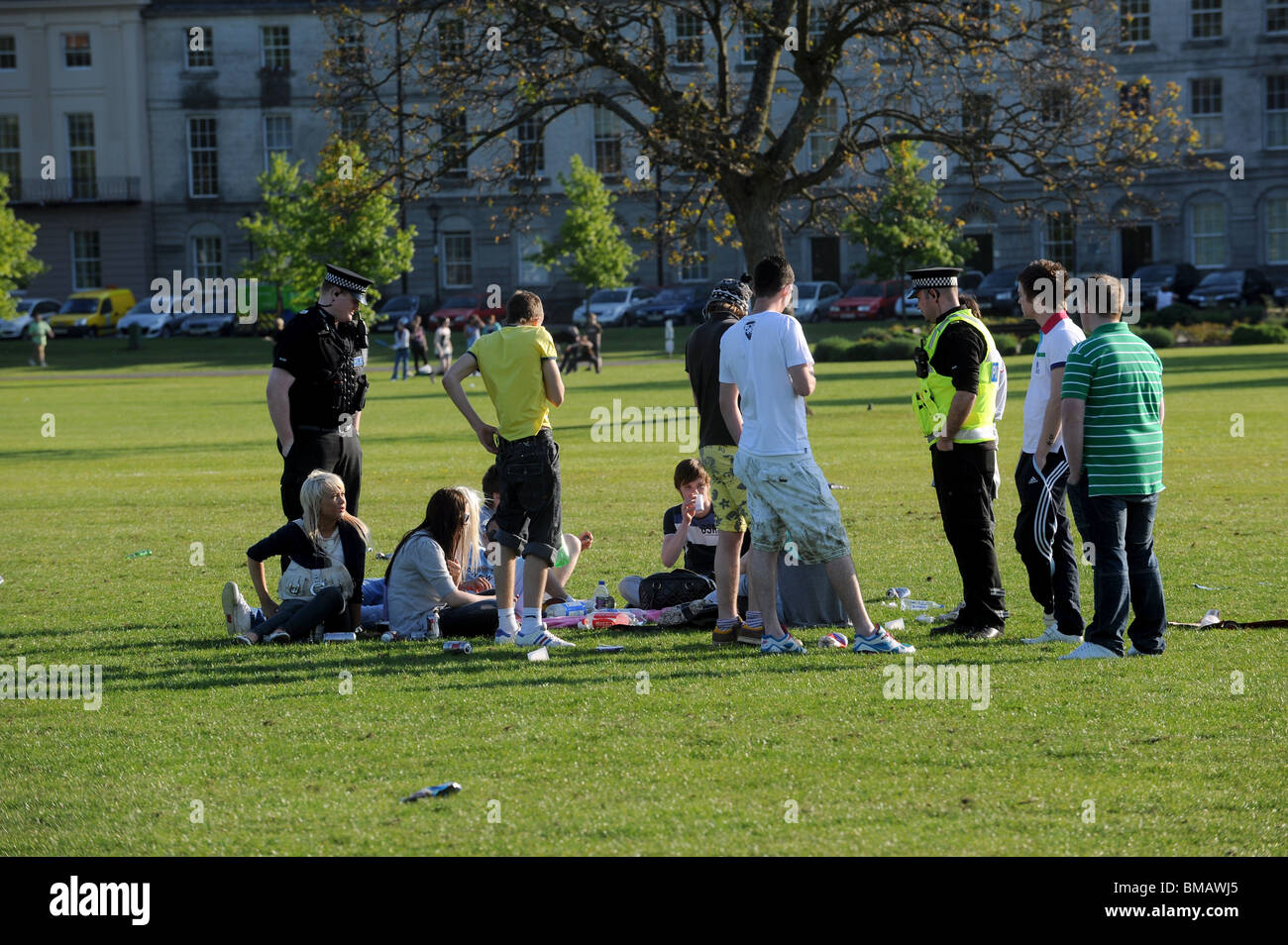 Police caution youths drinking in the park Stock Photo