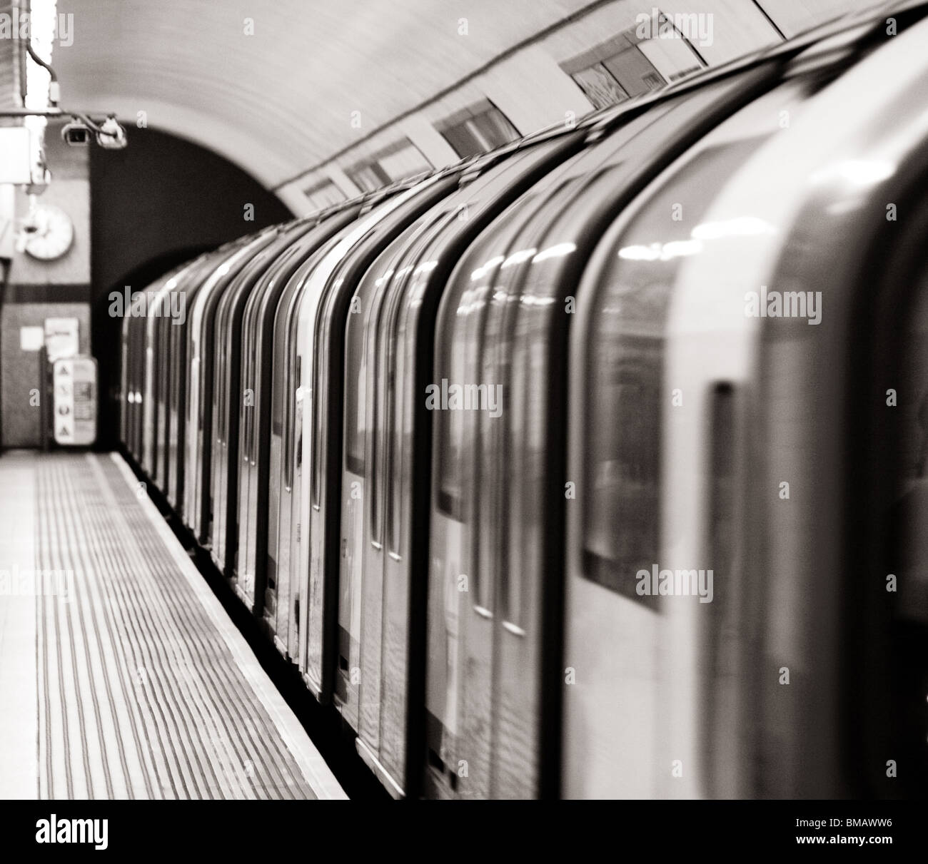 Tube Station Train leaving platform,London,England,United Kingdom Stock Photo