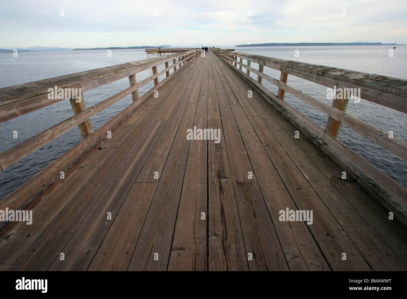 Sidney, British Columbia, Canada; A Dock Leading Out To The Ocean Stock Photo