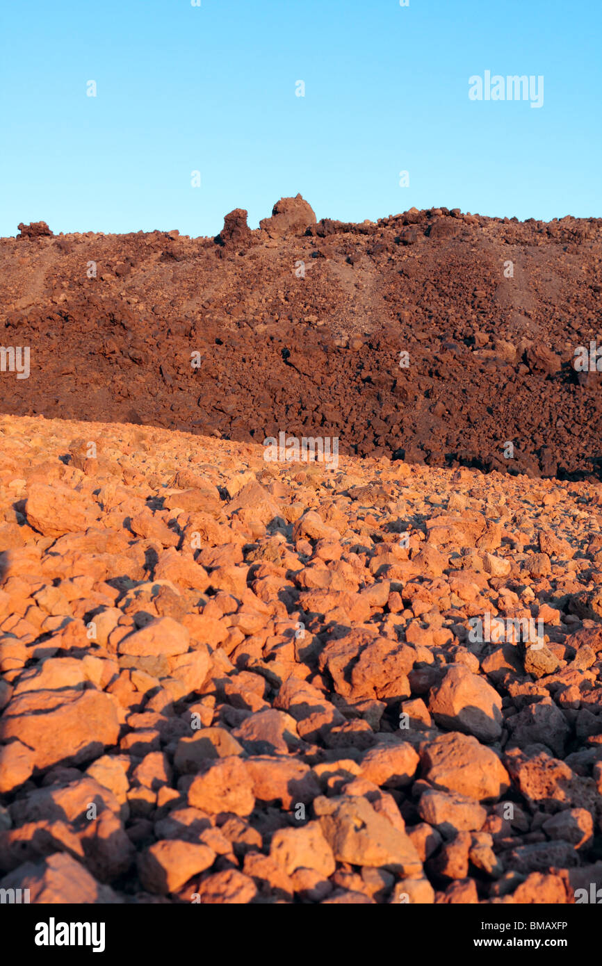 Fields of pumice stone and lava glowing red with the warm late evening sun at the base of Teide Tenerife Canary Islands Spain Stock Photo
