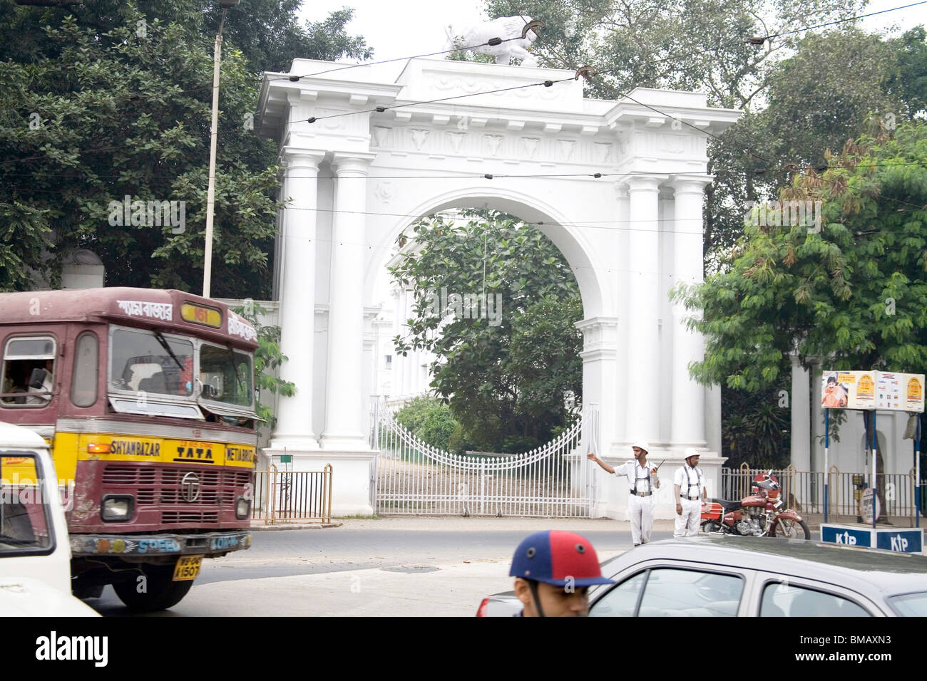 White gate of the Governor residence traffic scene of Calcutta now Kolkata ; West Bengal ; India Stock Photo