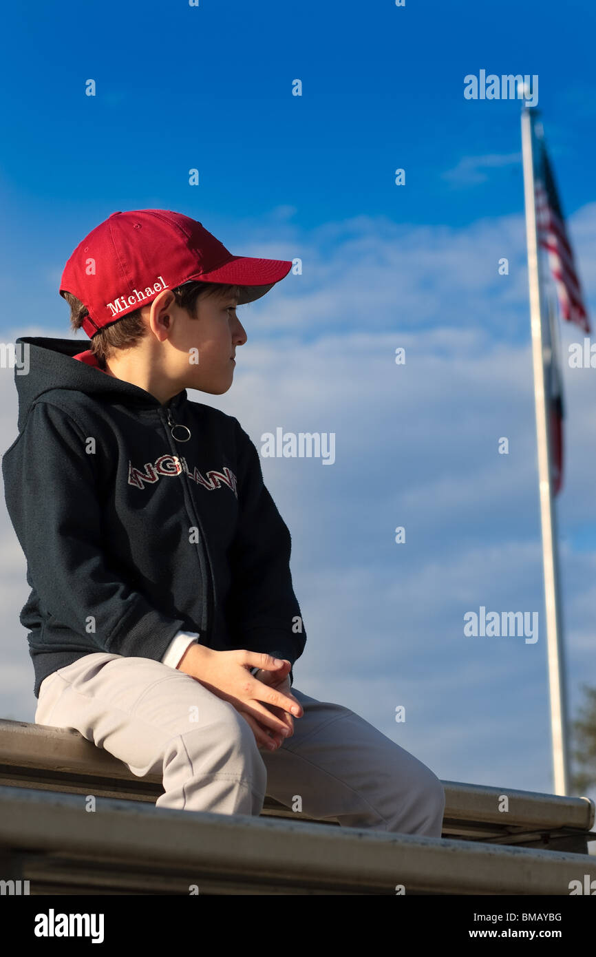 Seven year old baseball player looks off into distance Stock Photo Alamy