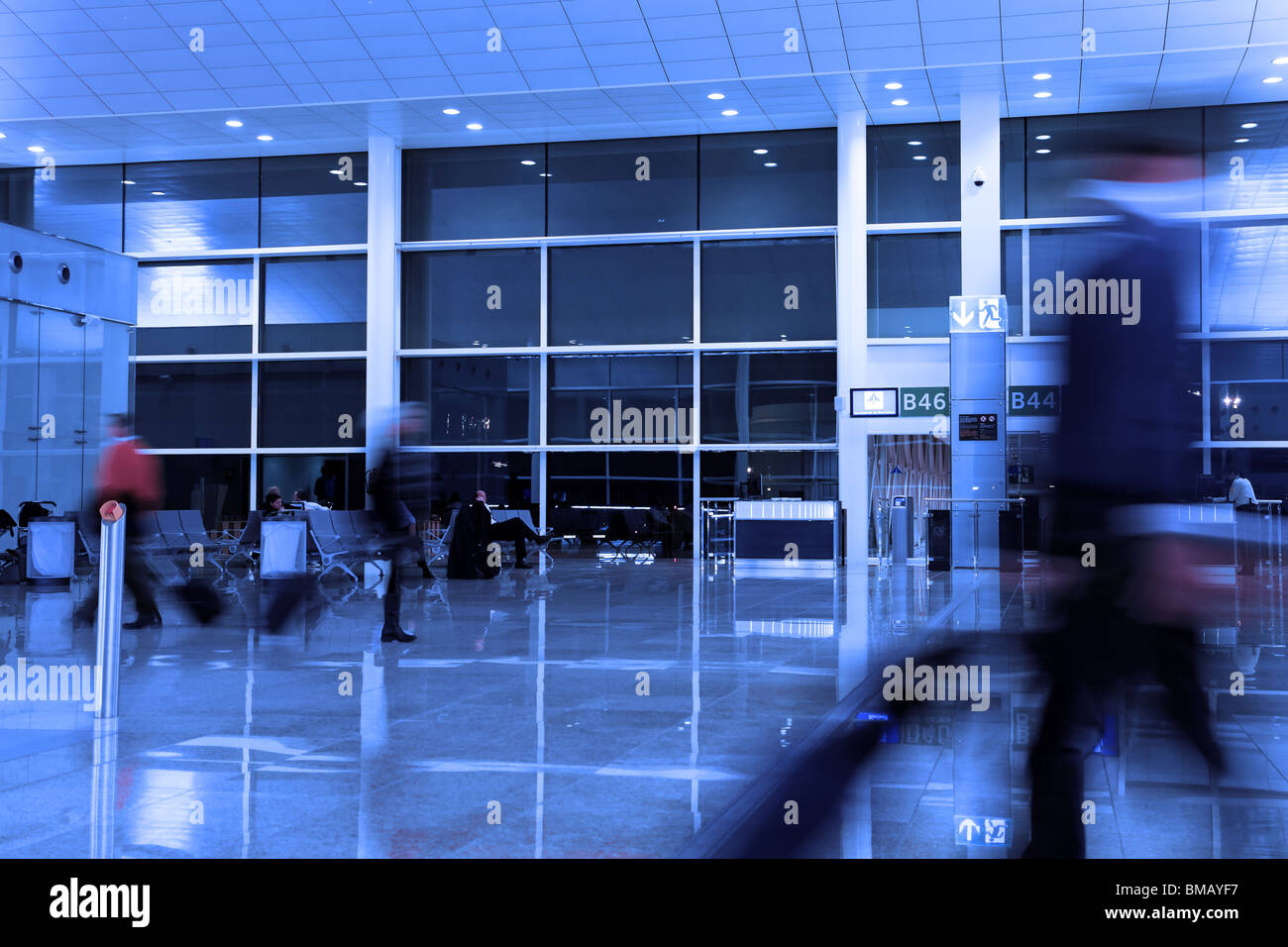 People running at airport blue tone Stock Photo