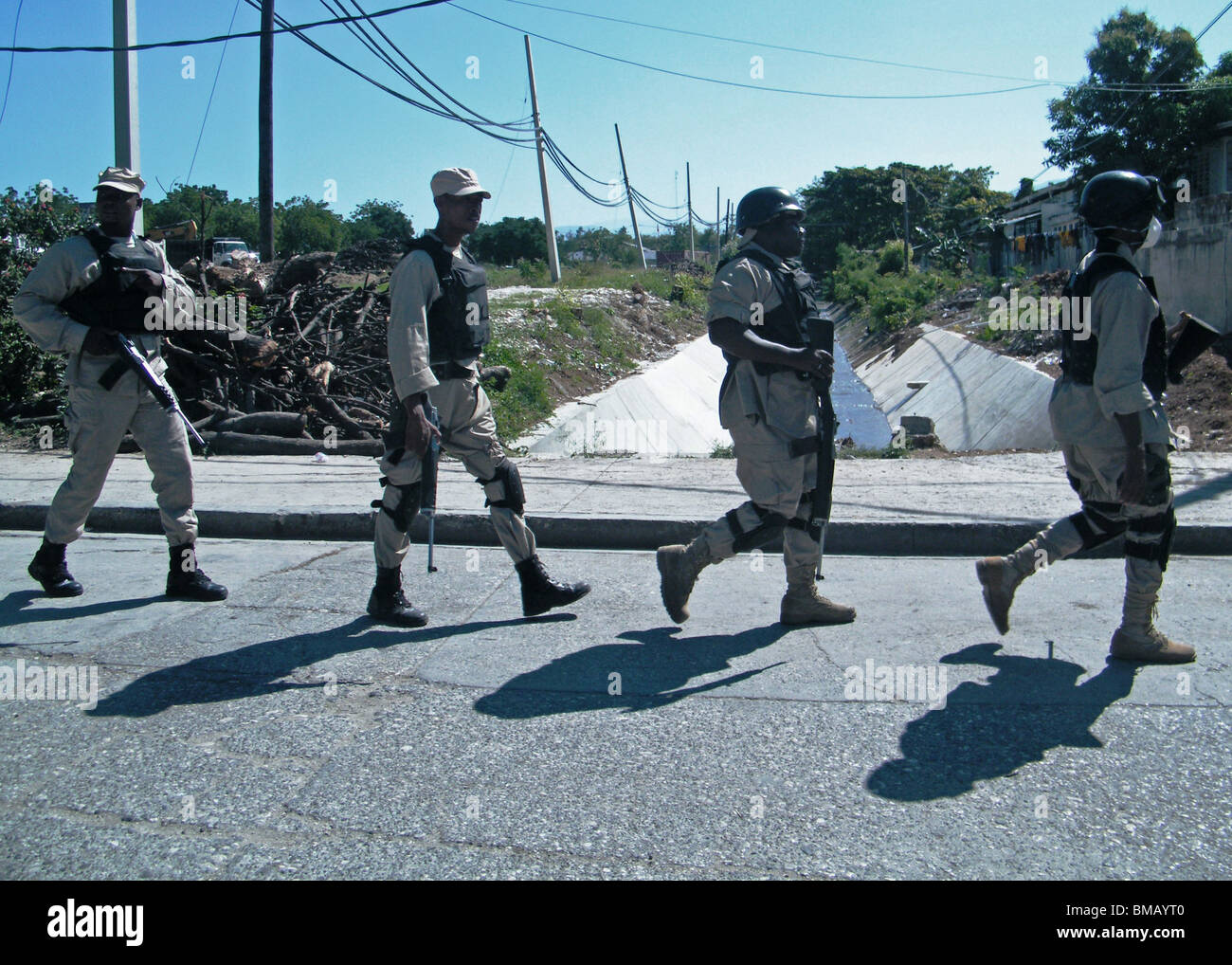 Members of the Hatian National Police patrol in Port au Prince after the Haiti earthquake Stock Photo