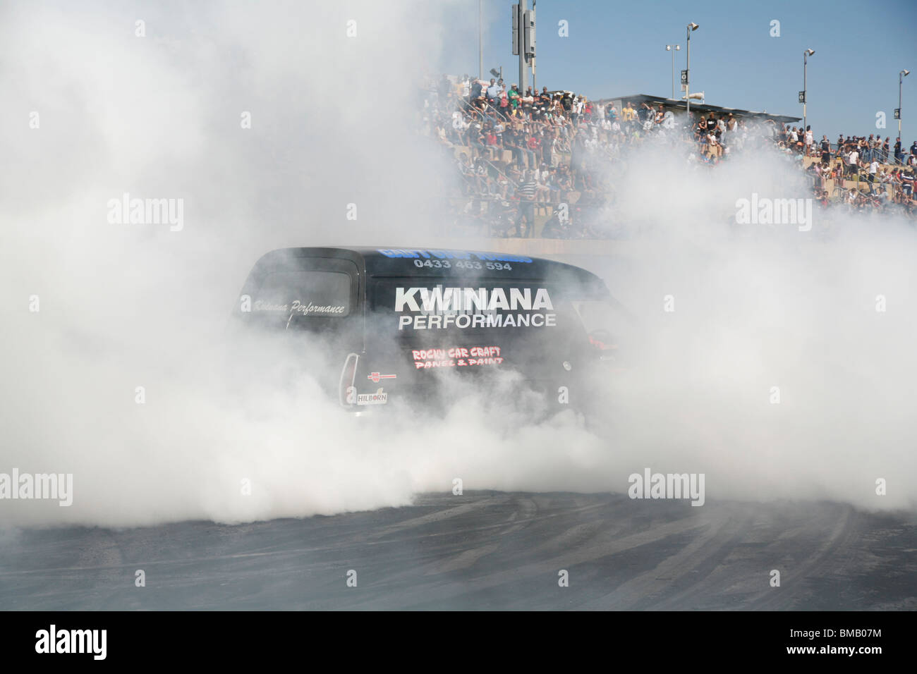 Iconic Australian Holden panel van performing a monster of a tire smoking burnout at the Perth Motorplex drag racing venue Stock Photo