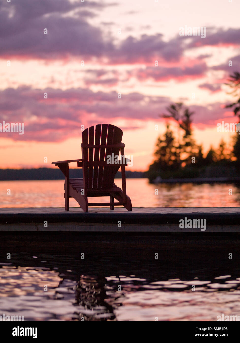 Deck chairs on dock sunset hi-res stock photography and images - Alamy