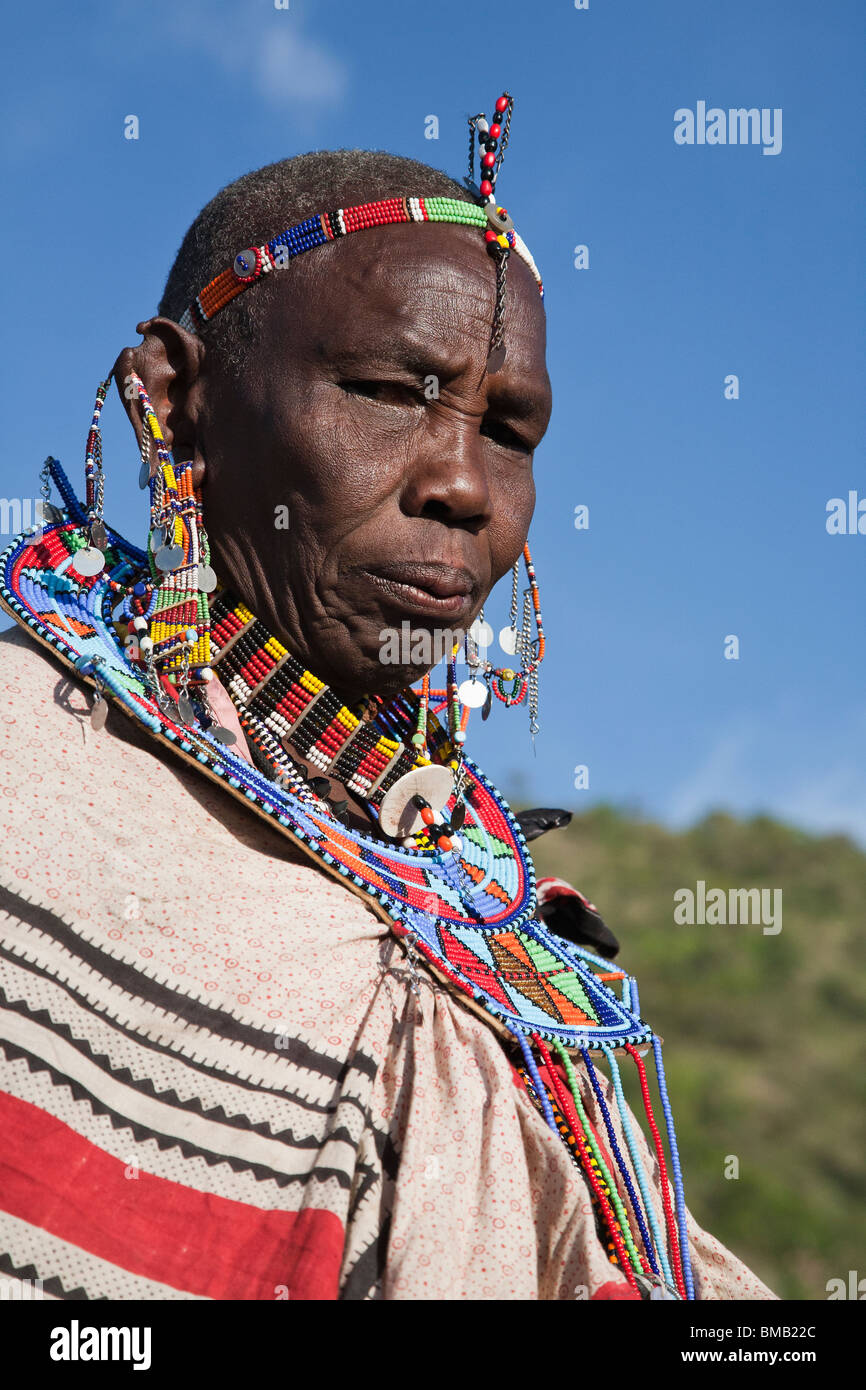 Cultural Close-up portrait of mature Masai woman in traditional tribal  costume beaded earrings, necklace Maasai Mara Kenya Stock Photo - Alamy
