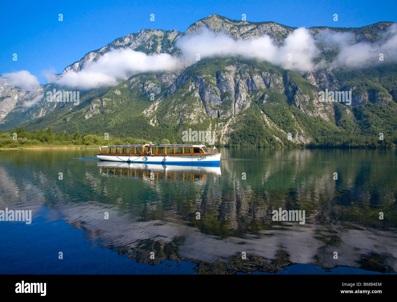 Boat on Lake Bohinj, largest lake in Slovenia, Triglav National Park, Slovenia Stock Photo