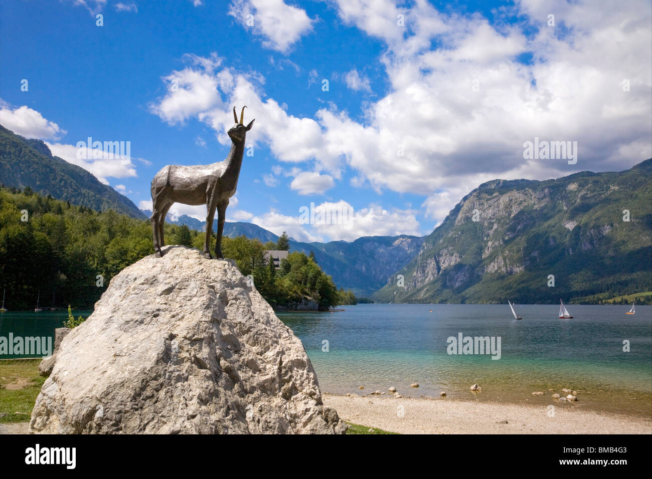 Sculpture of Zlatorog, the mythical chamois with golden horns, on the edge of Lake Bohinj, Triglav National Park, Slovenia Stock Photo