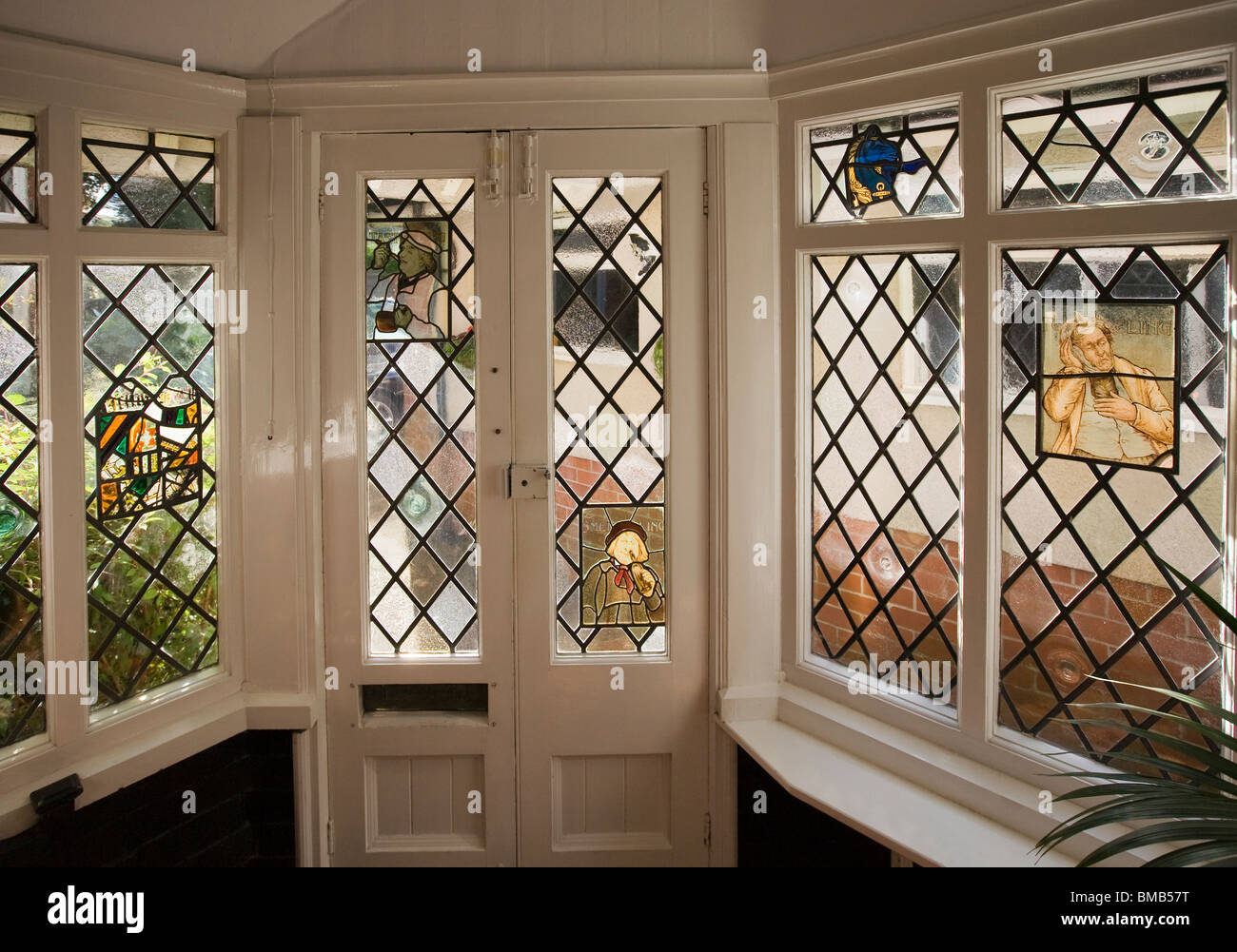 Houses Edwardian arts and crafts House, decorative stained glass decorating entrance porch Stock Photo