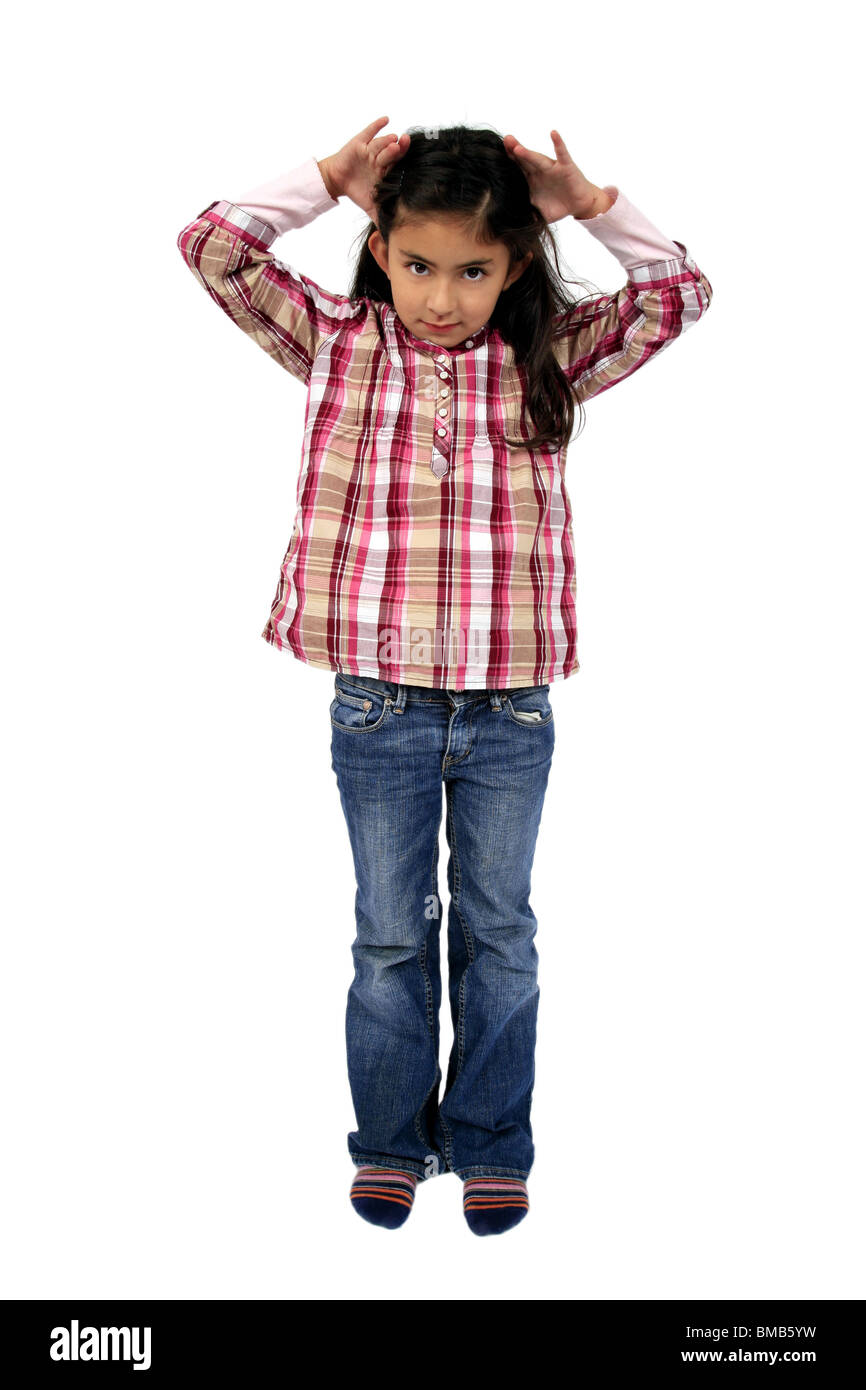 little girl with her hands on her head Stock Photo - Alamy