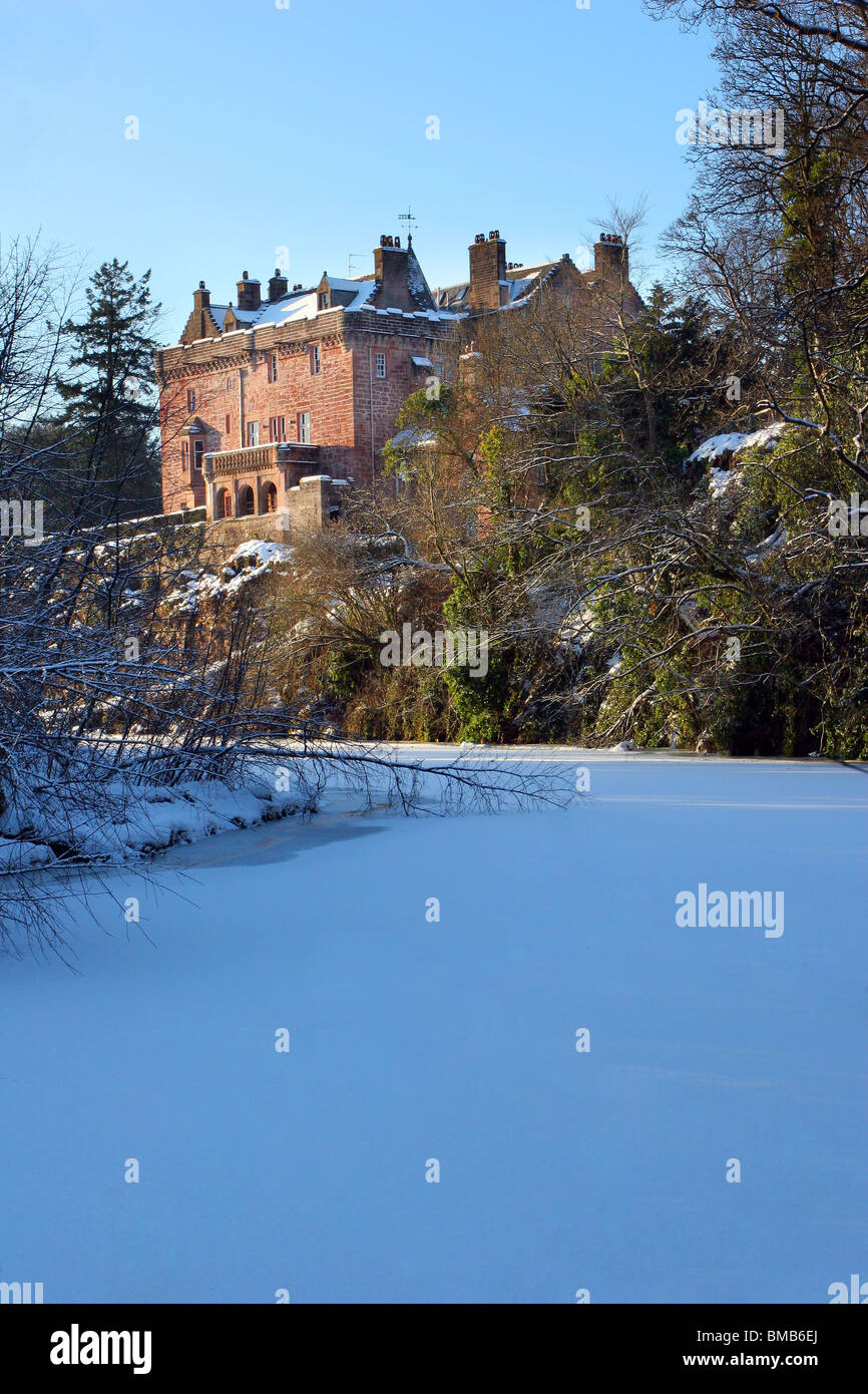 Sorn Castle with the River Ayr frozen over in winter 2010. The castle dates from the 14th Century. Stock Photo