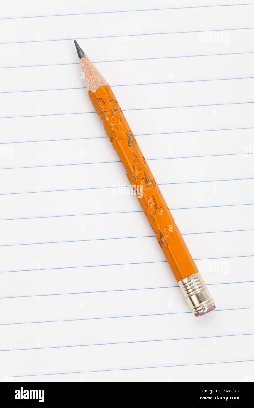 Biting Pencil and striped paper Stock Photo