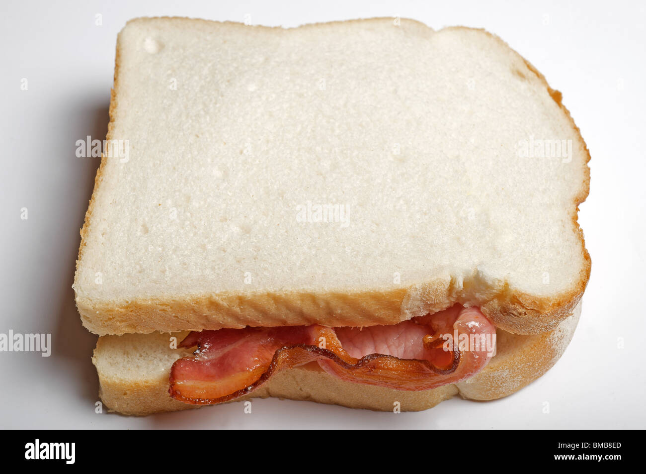 Freshly made white bread bacon sandwich Stock Photo Alamy