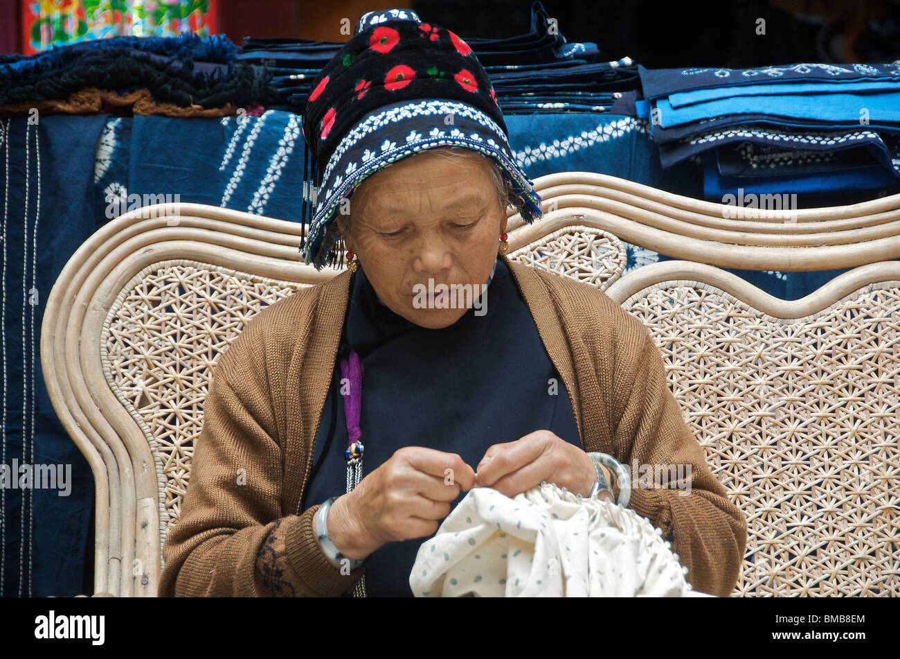 Portrait woman sewing in textile factory Yunnan China Stock Photo