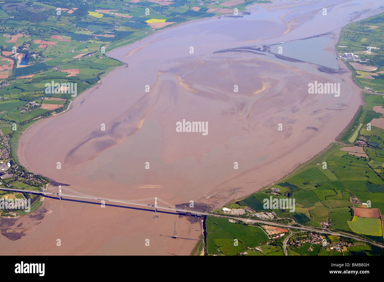 Aerial view of the 1 mile wide Severn Bridge which carries the M48 motorway between England and Wales seen here at low tide. Stock Photo