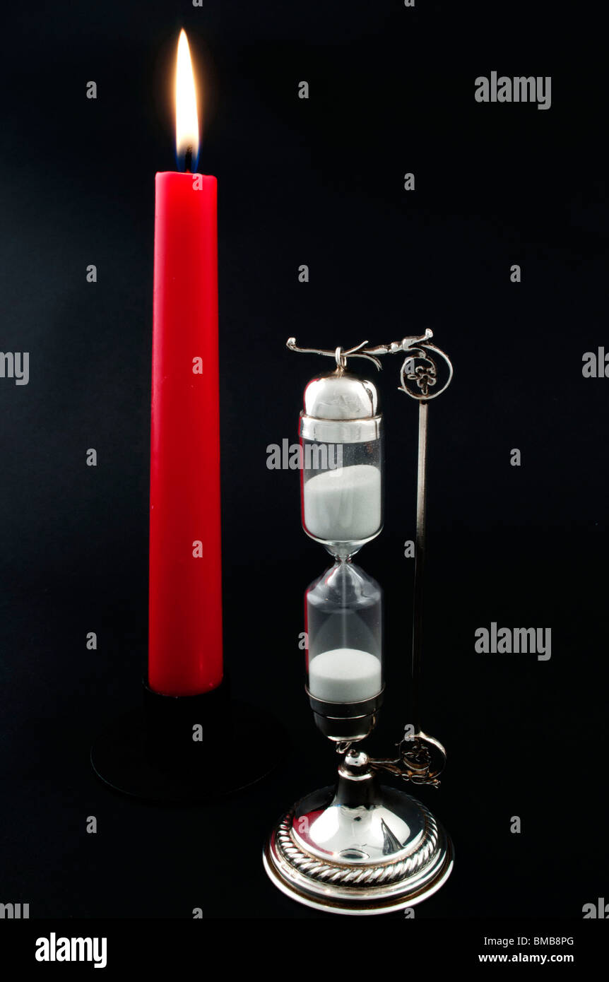 Red candle is light, time is passing away Stock Photo Alamy