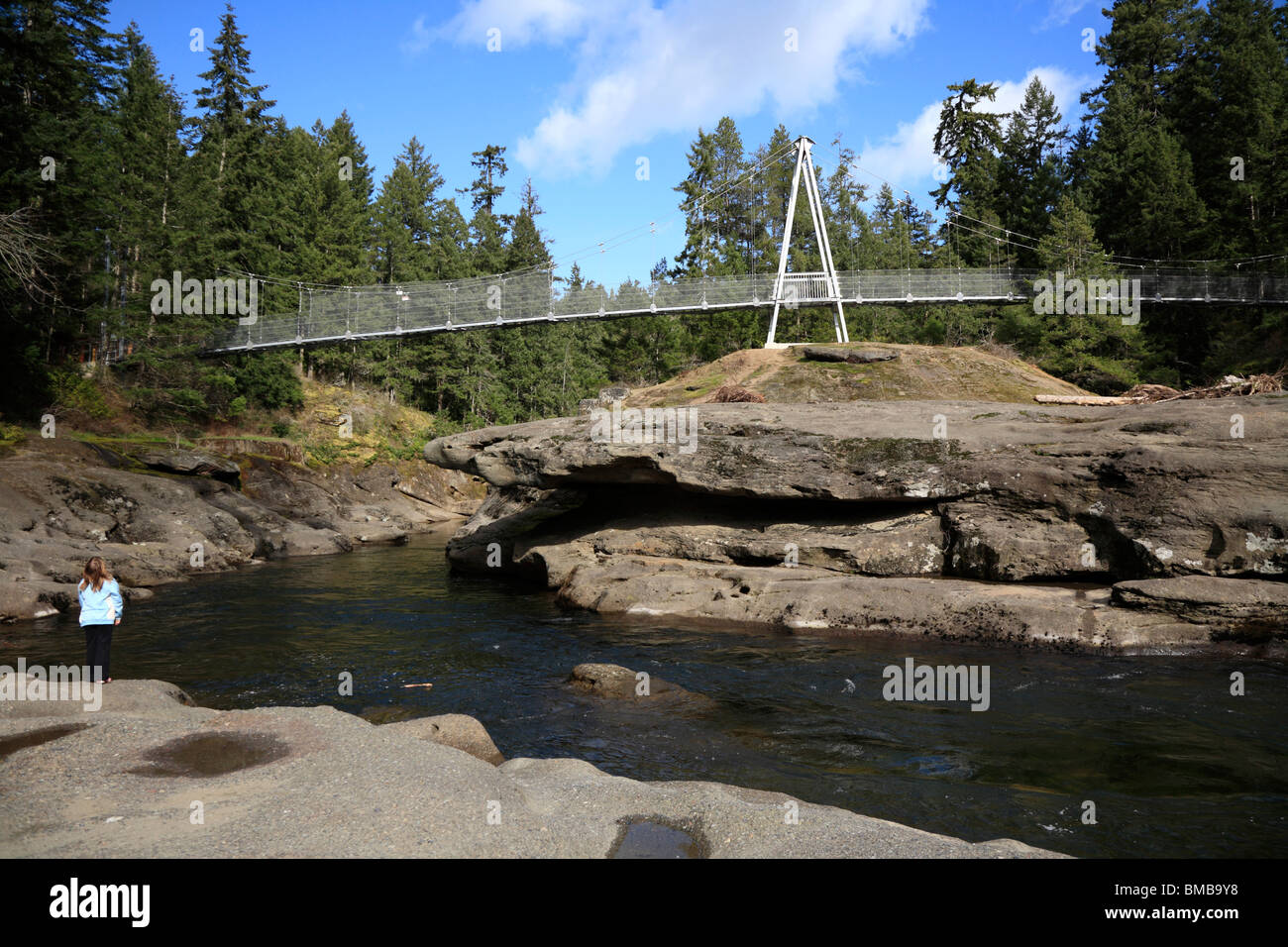 One child at the top of Englishman river gorge and suspension bridge  near Parksville on Vancouver Island BC Canada Stock Photo