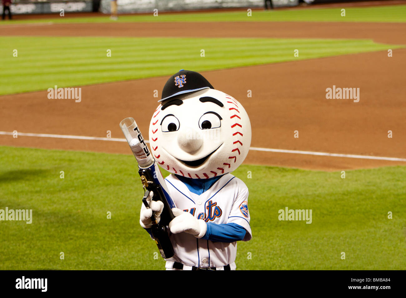 Mascot Mr. Mets at the MLB baseball game with a t-shirt gun at Citi Field Park stadium in New York. Stock Photo