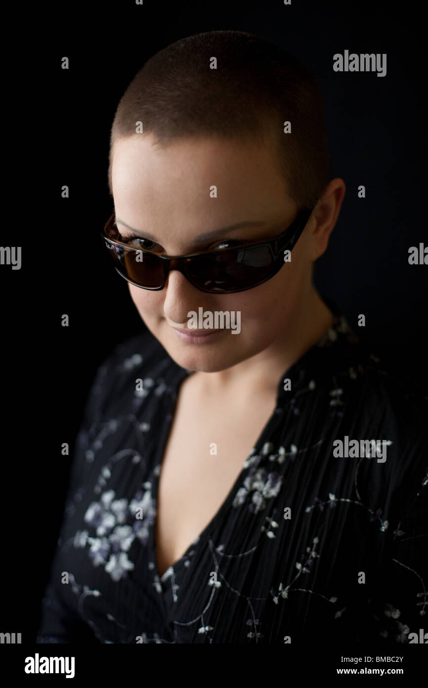 Headshot portrait of a woman with short hair wearing sunglasses, London, England, UK Stock Photo