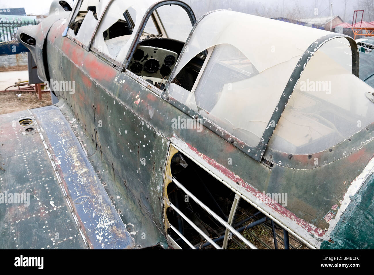abandoned decommissioned vintage airplane in a field Stock Photo