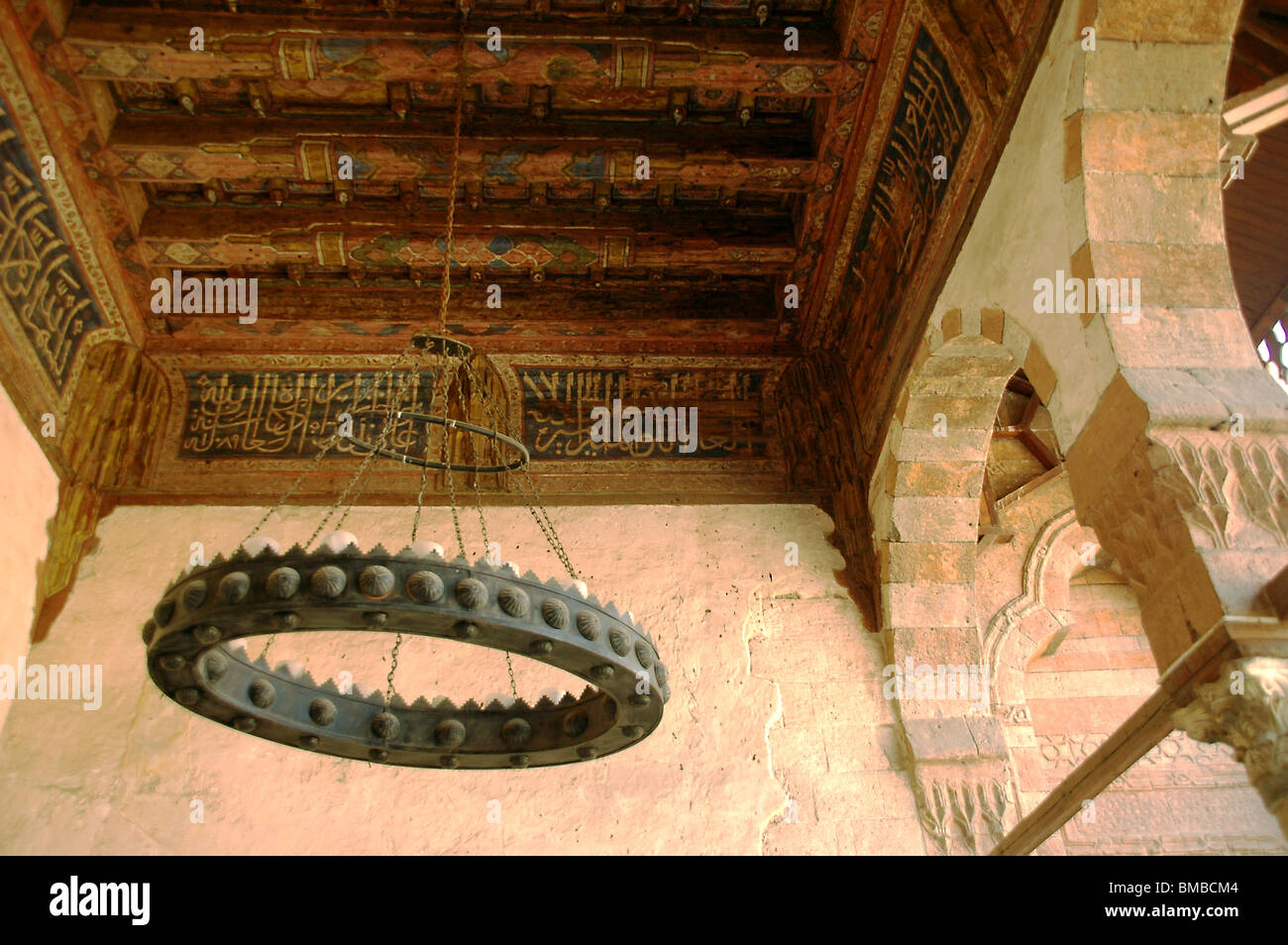An iron chandelier and wooden ceiling decorated with Arabic script from the 14th century Mameluke era Amir Taz Palace in medieval Cairo, Egypt. Stock Photo