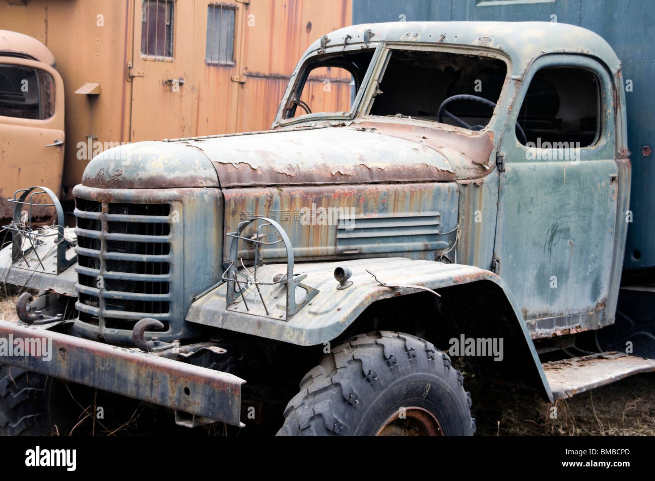 abandoned rusty old antique truck in a field Stock Photo - Alamy