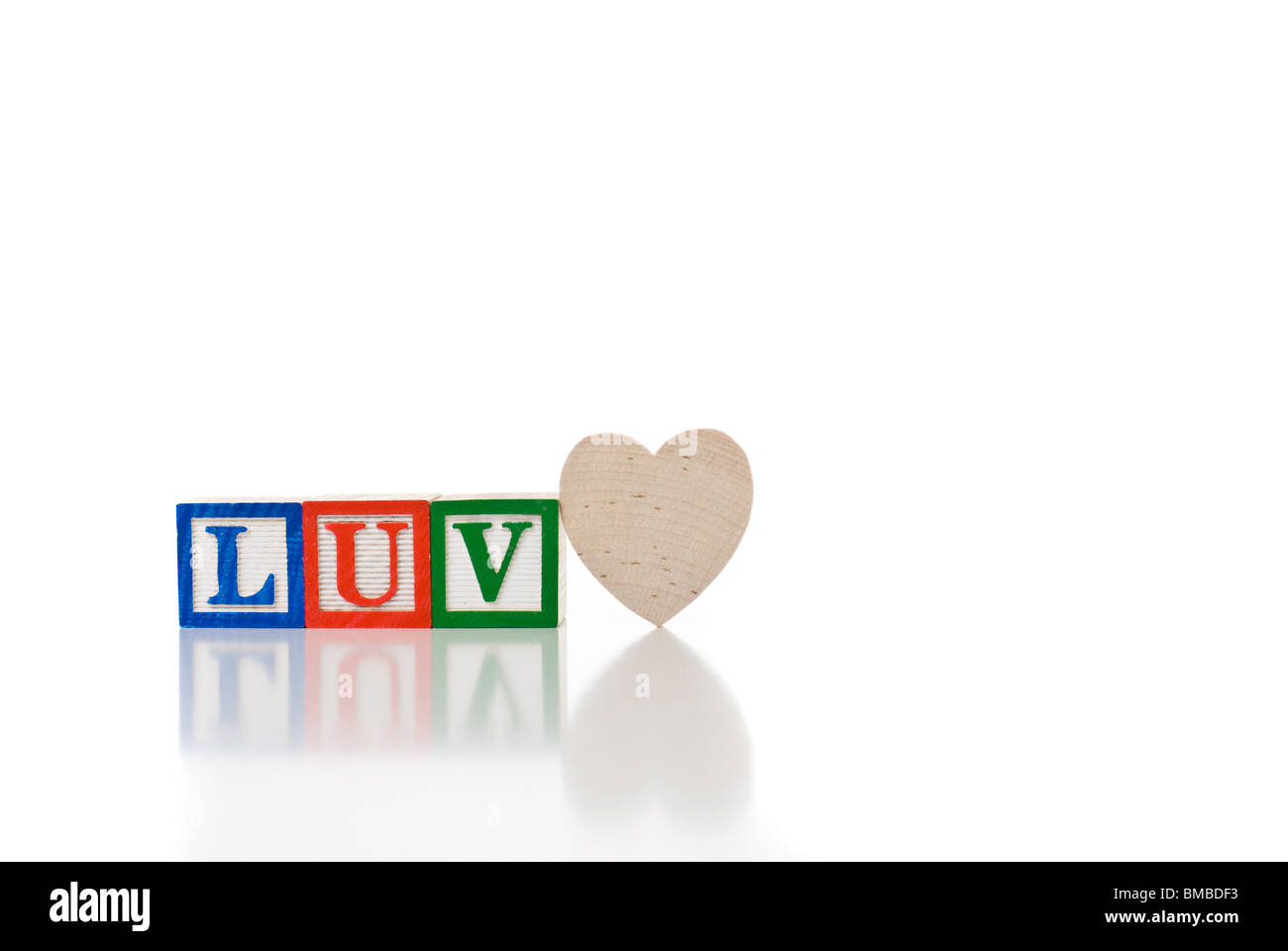 Colorful children's blocks spelling LUV with a heart Stock Photo