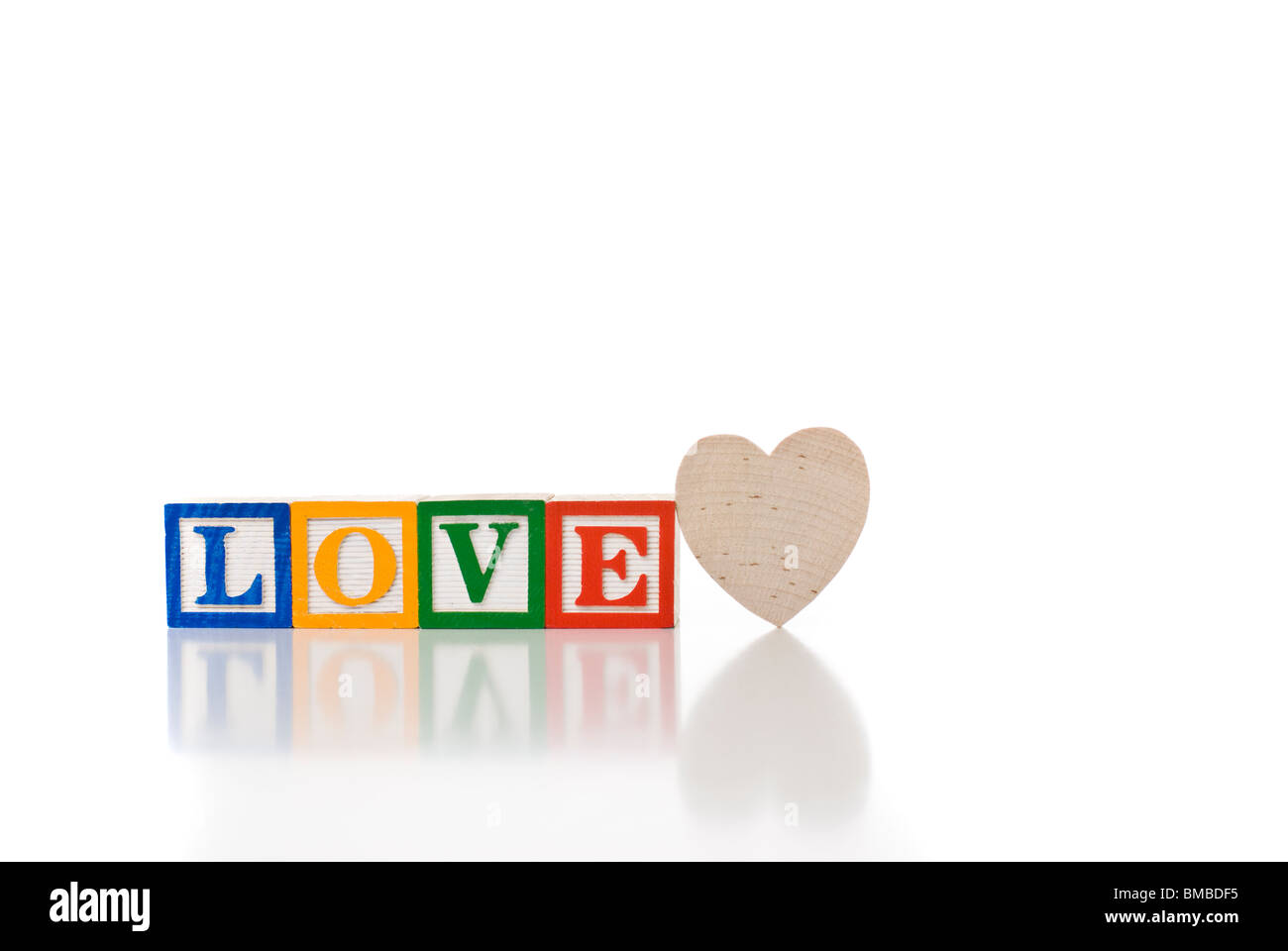 Colorful children's blocks spelling LOVE with a heart Stock Photo