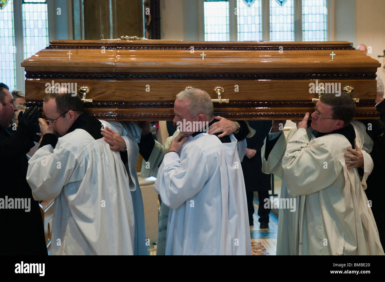 Fellow priests carry the coffin of Cardinal Cahal Daly Stock Photo