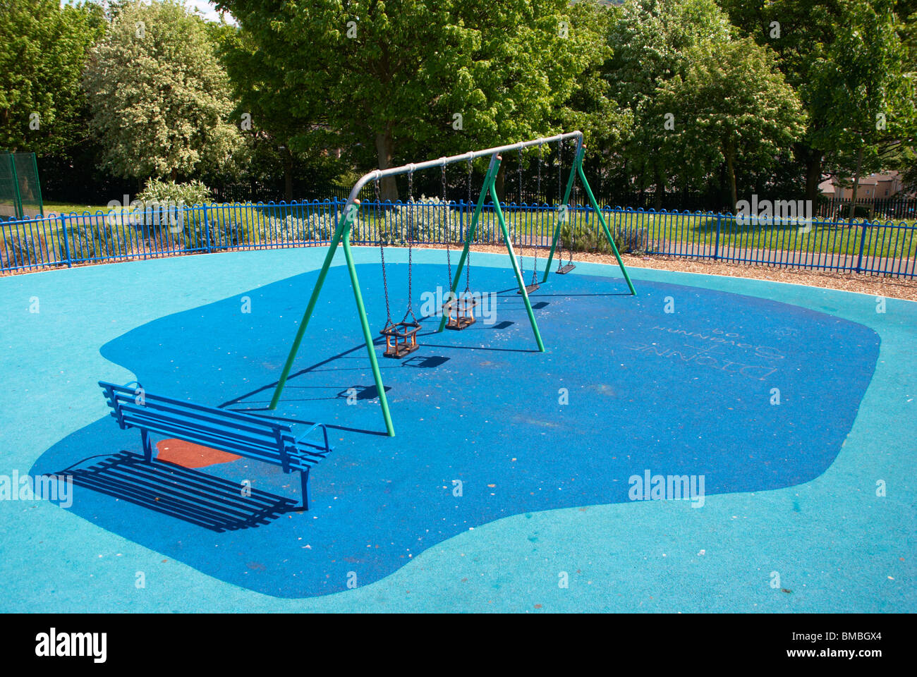 swings at a children's playground Stock Photo Alamy