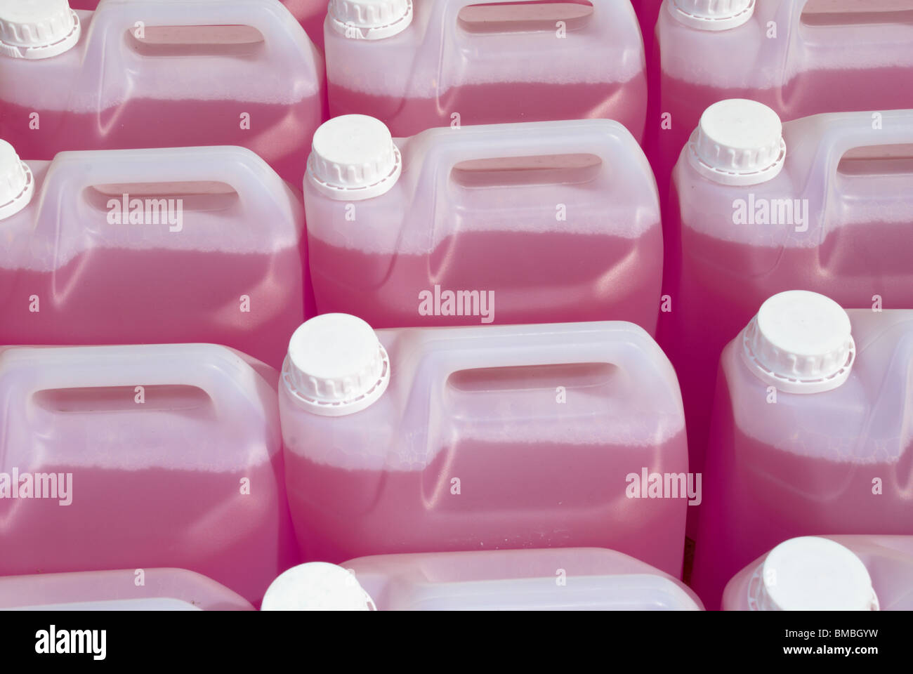 Plastic bottles of pink screen wash Stock Photo Alamy