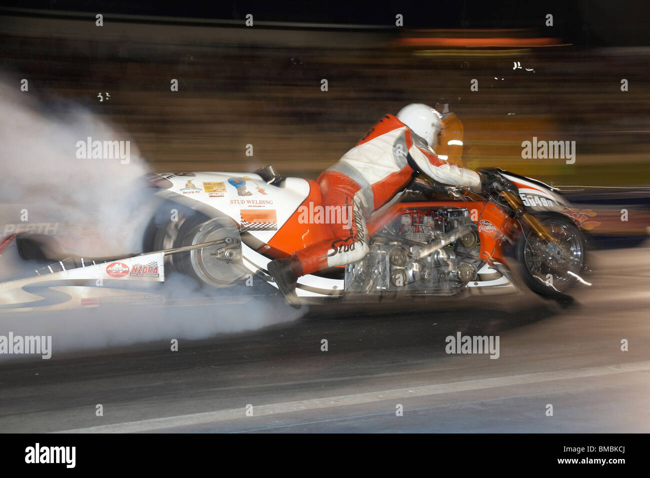New Zealand motorcycle drag racer, Athol Williams, performs a burnout on his supercharged custom drag racing motorcycle Stock Photo